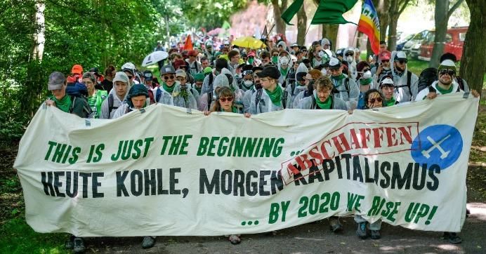 Activists with Ende Gelände march to stage a blockade of the German Garzweiler surface mine on June 21, 2019. 