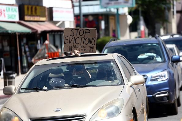 Cars display signs requesting to stop evictions as protesters supporting the rent freeze gather in Chinatown on August 10, 2020 in Los Angeles, California. During the pandemic, California has passed a number of eviction protections that are under evaluation as they have started expiring. (Photo: Tommaso Boddi/Getty Images)