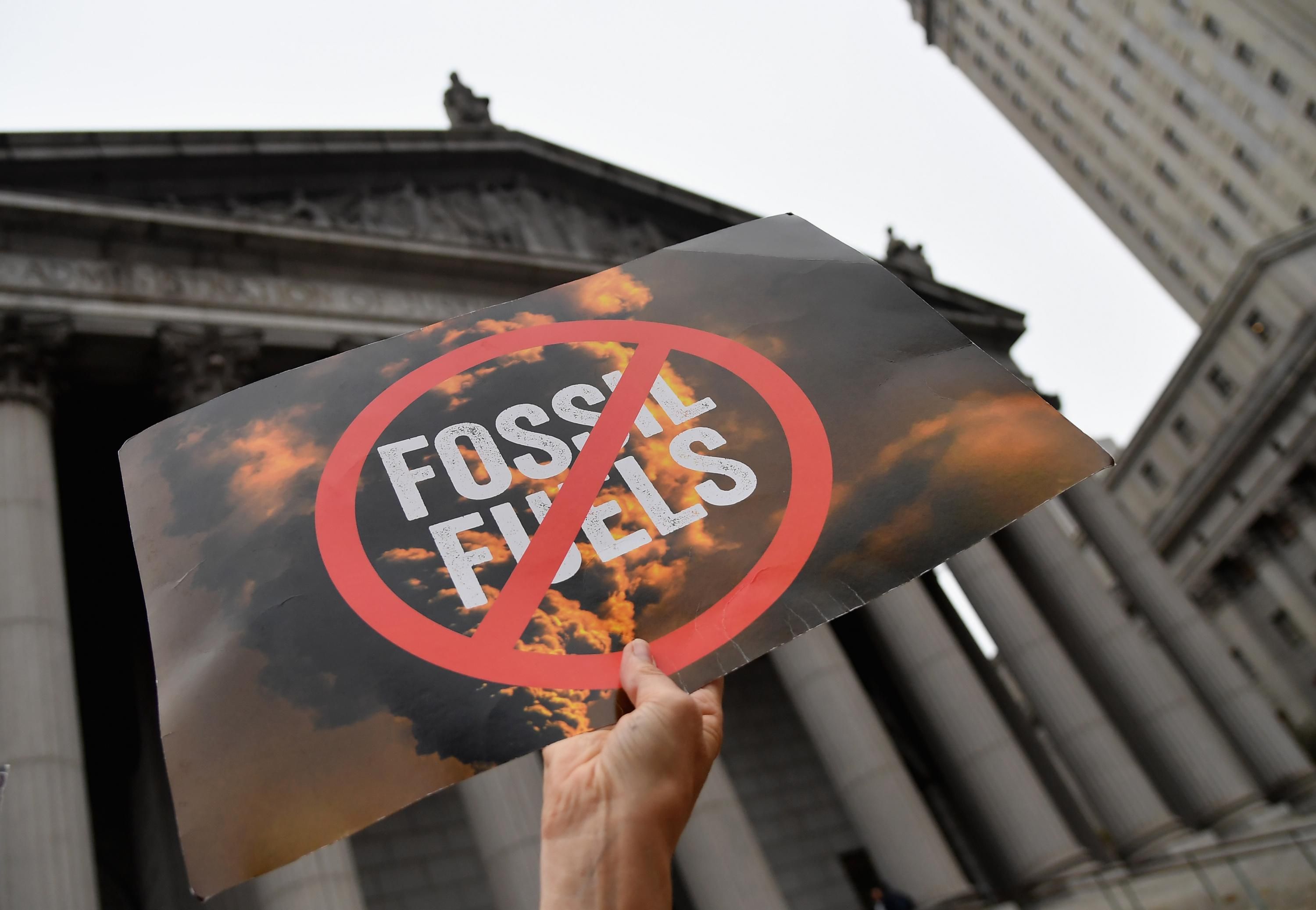 Climate activists protest on the fist day of the ExxonMobil trial outside the New York State Supreme Court building on October 22, 2019 in New York City. (Photo: Angela Weiss/AFP via Getty Images)