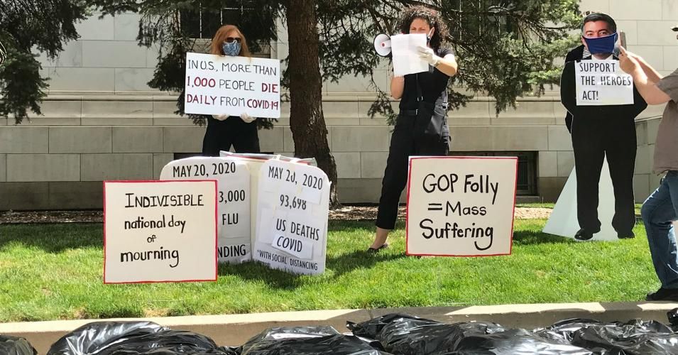 Colorado residents joined the National Day of Mourning on Wednesday with a vigil urging Sen. Cory Gardner (R-Colo.) to "put people first and support the HEROES Act." 