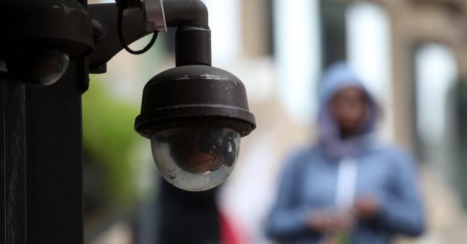 A video surveillance camera hangs from the side of a building on May 14, 2019 in San Francisco, California.