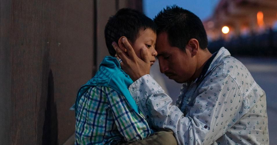 A Guatemalan father and son embrace after entering the US following a long and harrowing journey through Mexico. (Photo: Paul Ratje/AFP/Getty Images) 
