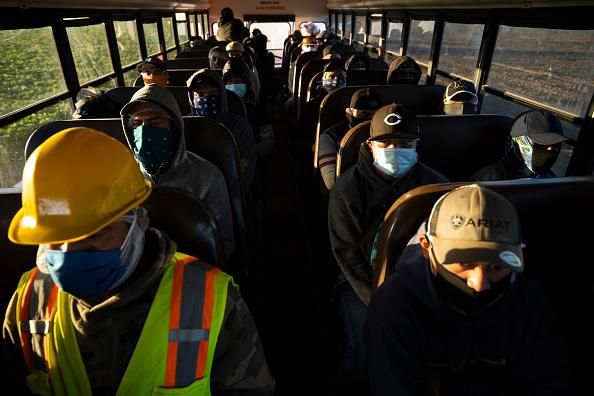 Farm laborers arrive for their shift on April 28, 2020 in Greenfield, California. (Photo: Brent Stirton/Getty Images)