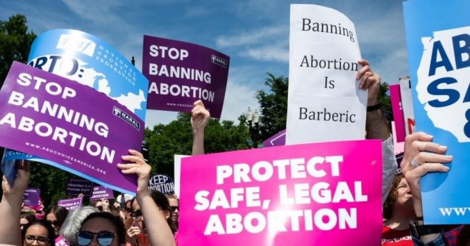 Demonstrators seen holding placards during the "Stop The Bans Day of Action for Abortion Rights" rally in front of the Supreme Court in Washington, D.C.