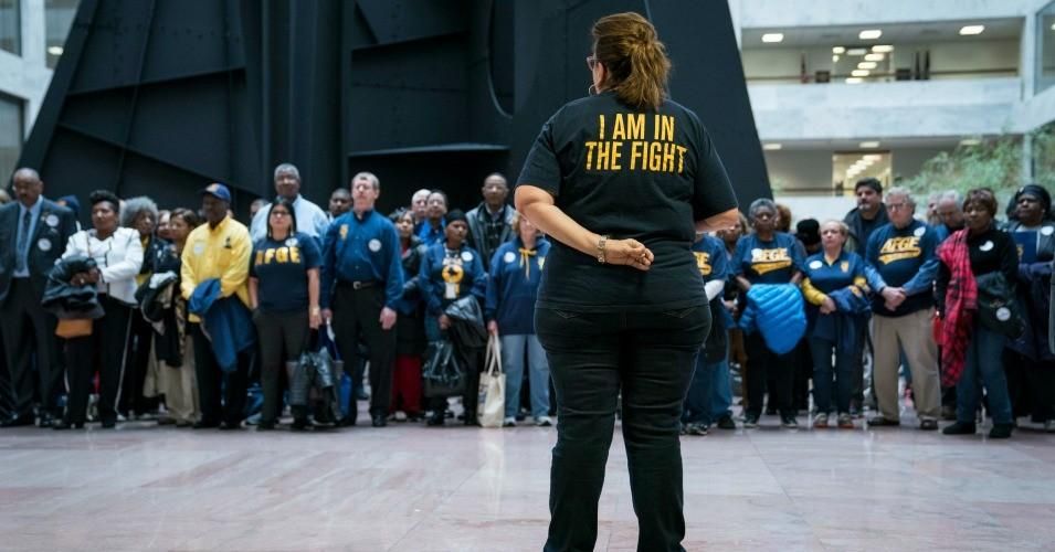Members and supporters of the American Federation of Government Employees (AFGE) participate in a "Stand Up, Stand In" protest in the Hart Senate Office Building Atrium as part of the 2020 Legislative and Grassroots Mobilization Conference on February 11, 2020 in Washington, D.C. AFGE members protested to raise awareness on how the Trump administration is hurting federal employees through various policies. 