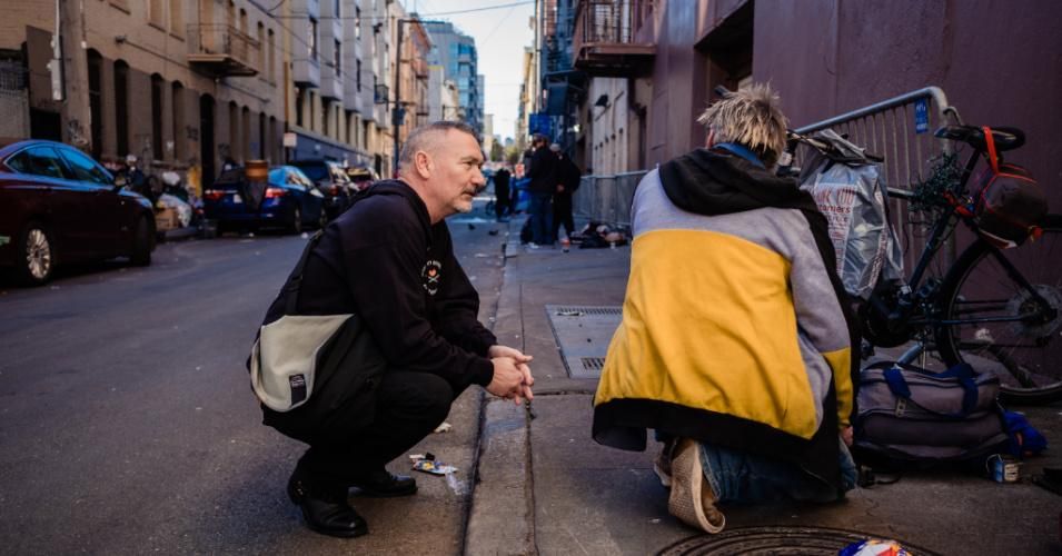 Paul Harkin, director of harm reduction at GLIDE, speaks with a person on an alleyway that is popular with people who use drugs on February 3, 2020. Harkin provides narcan, fentanyl detection packets, and tinfoil to people struggling with addiction as a part of outreach on the streets of San Francisco. (Photo: Nick Otto/Washington Post via Getty Images)