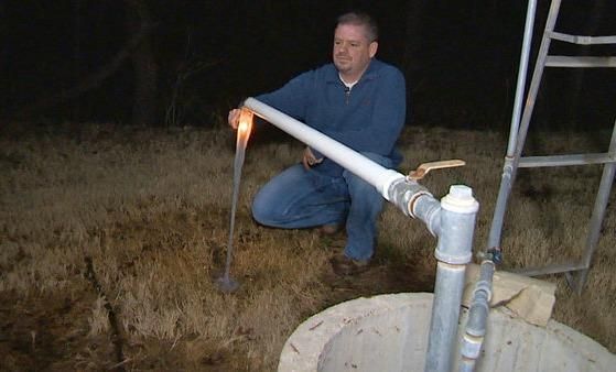Parker County homeowner Steve Lipsky demonstrated for local TV news outlet WFAA how water coming from his underground well can be ignited. (Credit: WFAA)