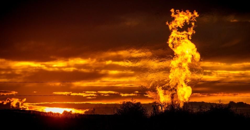 Flames from a flaring pit near a well in the Bakken Oil Field.