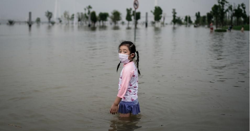 A young girl stands in Jiangtan park after it was flooded by heavy rains along the Yangtze river on July 10, 2020 in Wuhan, China. (Photo: Getty Images)