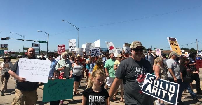 Immigrant rights advocates marched to Fort Sill in Lawton, Oklahoma on Saturday, July 20, 2019. 