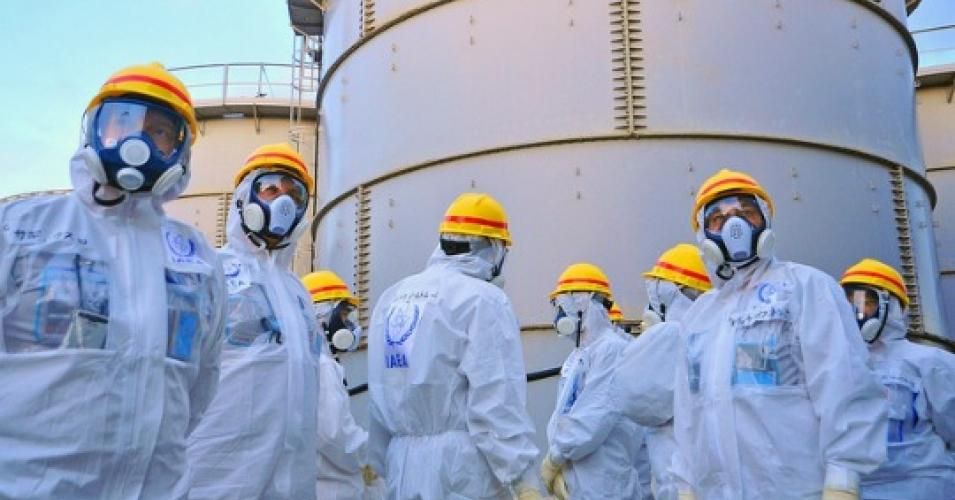 A team from the IAEA looks at water storage tanks at Fukushima in Nov. 2013. (Photo: IAEA Imagebank)