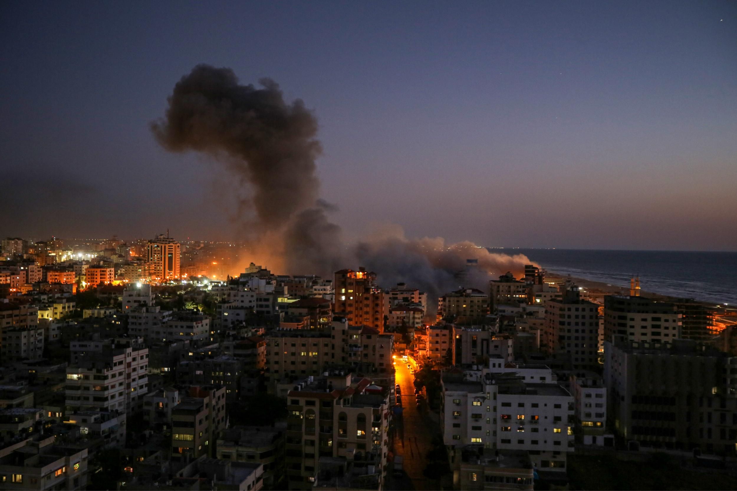 Flames and smoke rose from an area of Gaza City targeted by Israeli airstrikes in May 2021. (Photo: Ali Jadallah/Anadolu Agency via Getty Images) 