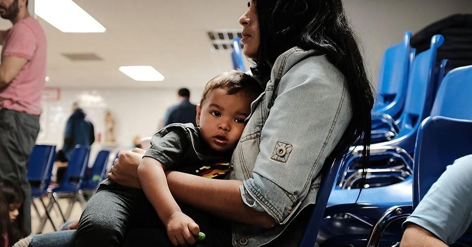 <p>A woman sits with her son Jaydan at the Catholic Charities Humanitarian Respite Center after recently crossing the U.S.-Mexico border on June 21, 2018 in McAllen, Texas. (Photo: Spencer Platt/Getty Images)</p>