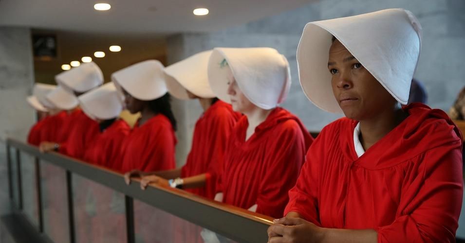 Women dressed as handmaids from the TV series and Margaret Atwood novel "The Handmaid's Tale" greeted Judge Brett Kavanaugh at his confirmation hearing to be named the next U.S. Supreme Court justice. 
