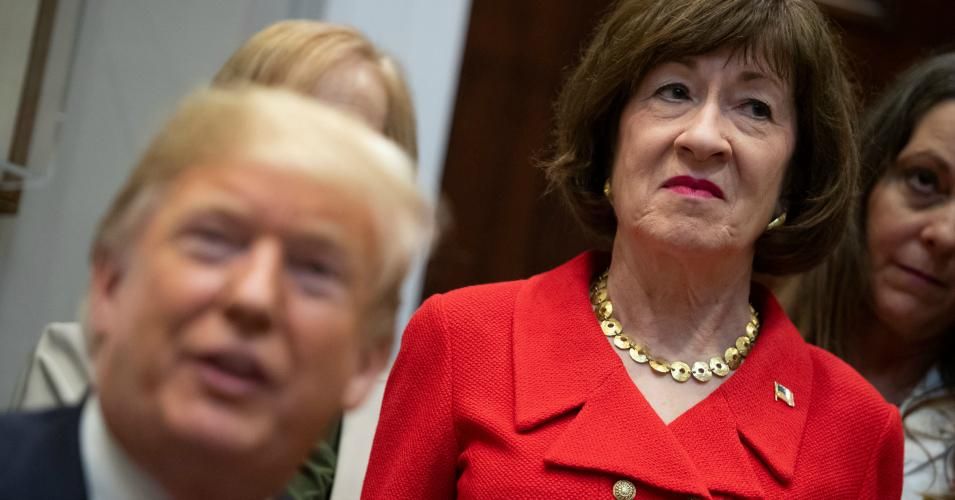 Sen. Susan Collins (R-Maine) stands alongside U.S. President Donald Trump as he signs bills intended to lower prescription drug prices during a ceremony in the Roosevelt Room of the White House in Washington, D.C, October 10, 2018. (Photo: Saul Loeb/AFP via Getty Images)