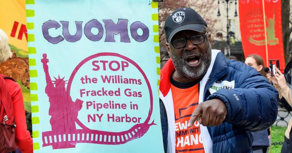 A protester is seen holding a placard calling for a stop to the Williams natural gas pipeline during a demonstration held on Center Street adjacent to City Hall Park in New York City. 