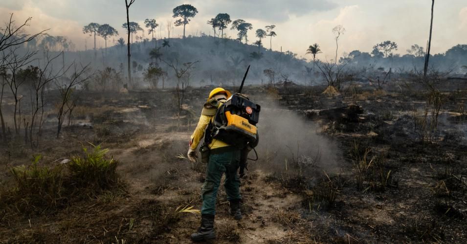 Members of the IBAMA forest fire brigade, called Prevfogo, fight burning in the Amazon