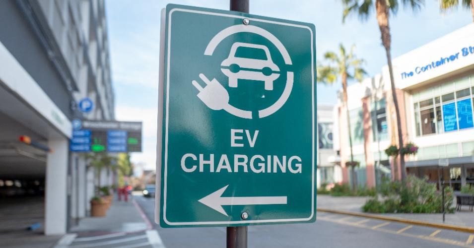 A sign signals the direction for an electric vehicle charging station on Santana Row in the Silicon Valley, San Jose, California, on January 3, 2020. (Photo: Smith Collection/Gado/Getty Images)
