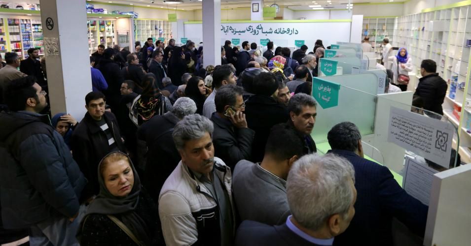 Iranians wait to get prescription drugs at the state-run "13 Aban" pharmacy in Tehran on Feb. 19, 2020.