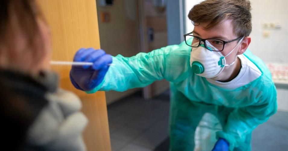 Using a swab, Maximilian Schilling from the ASB takes a sample for a suspected case of the new coronavirus at the test center in Mecklenburg-Western Pomerania, Ludwigslust on March 19, 2020. (Photo: Jens Büttner/dpa-Zentralbild/dpa/picture alliance via Getty Images)
