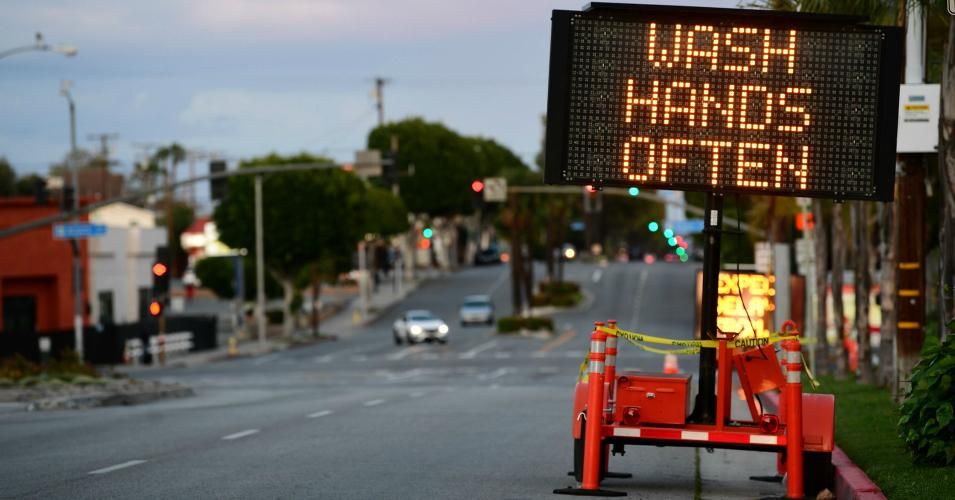 A sign reminds residents to 'Wash Hands Often' on the quiet streets of Monterey Park, California on March 26, 2020 as people stay at home due to the coronavirus pandemic. (Photo: Frederic J. Brown/AFP via Getty Images)