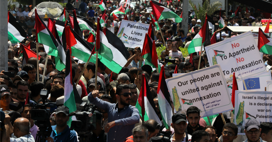 Demonstrators take part in a rally as Palestinians call for a 'day of rage' to protest against Israel's plan to annex parts of the Israeli-occupied West Bank, in Gaza City July 1, 2020. (Photo: Majdi Fathi/NurPhoto via Getty Images)
