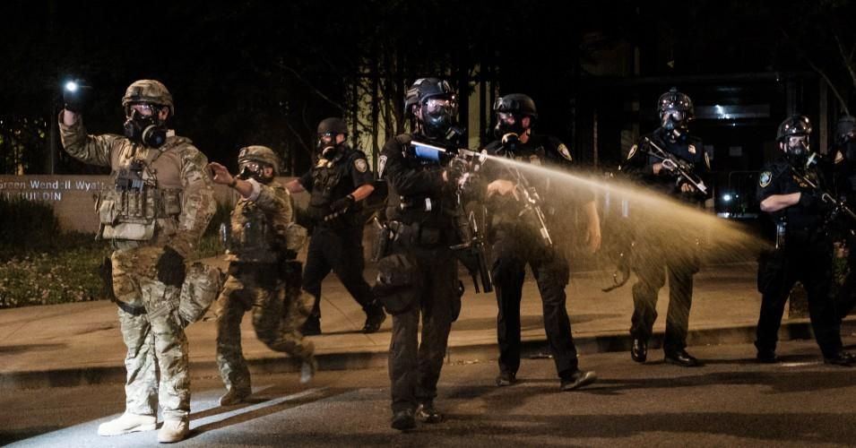 Federal officers use tear gas and other crowd dispersal munitions on protesters outside the Multnomah County Justice Center on July 17, 2020 in Portland, Oregon. (Photo: Mason Trinca/Getty Images)