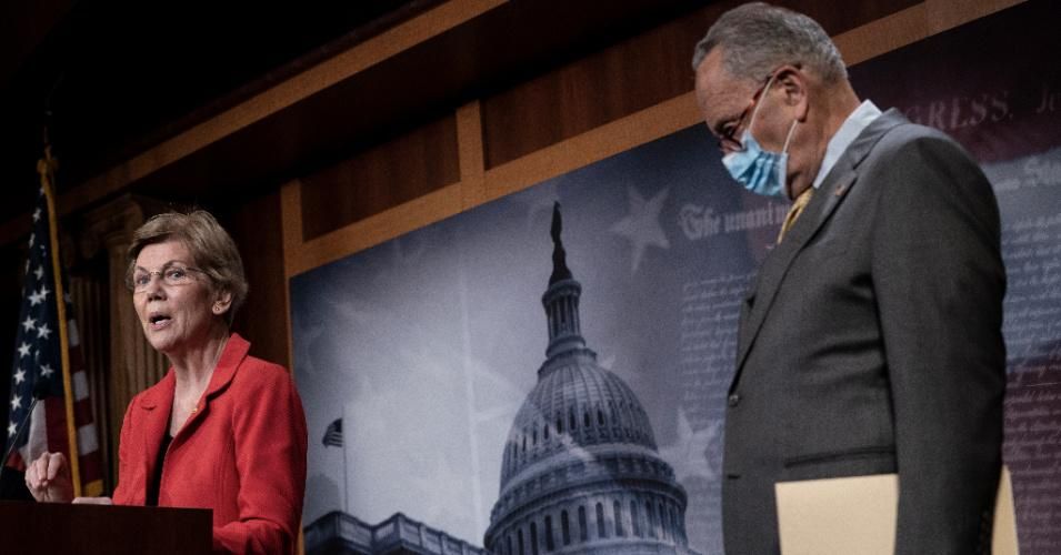 Sen. Elizabeth Warren (D-Mass.) speaks as Senate Minority Leader Chuck Schumer (D-N.Y.) looks on during a news conference at the U.S. Capitol on July 22, 2020. (Photo: Drew Angerer/Getty Images)