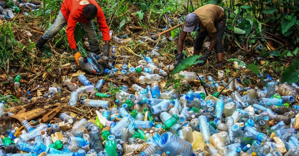 Volunteers remove plastic bottles and other trash polluting Ruaka River on August 25, 2020. Increasing production of single-use plastics for beverage and other uses has become a nightmare in solid waste management in Kenya. (Photo: James Wakibia/SOPA Images/LightRocket via Getty Images)
