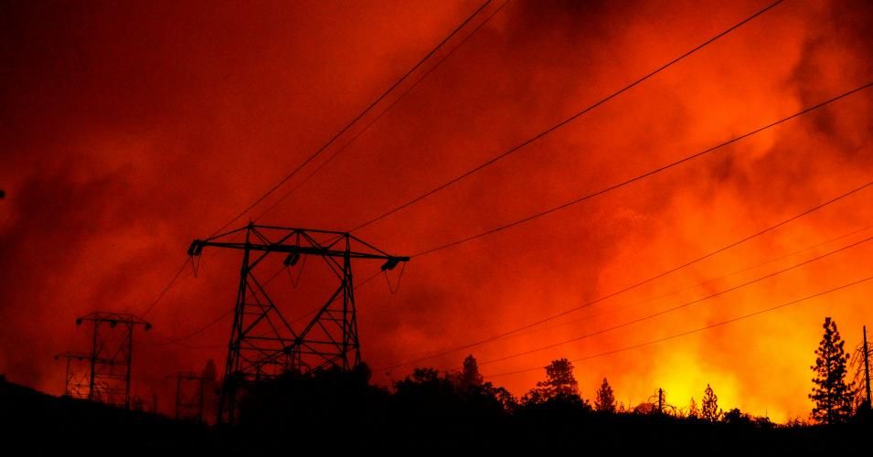 Power lines are cast in silhouette as the Creek Fire creeps up on on the Shaver Springs community off of Tollhouse Road on September 8, 2020 in Auberry, California. (Photo: Kent Nishimura / Los Angeles Times via Getty Images)