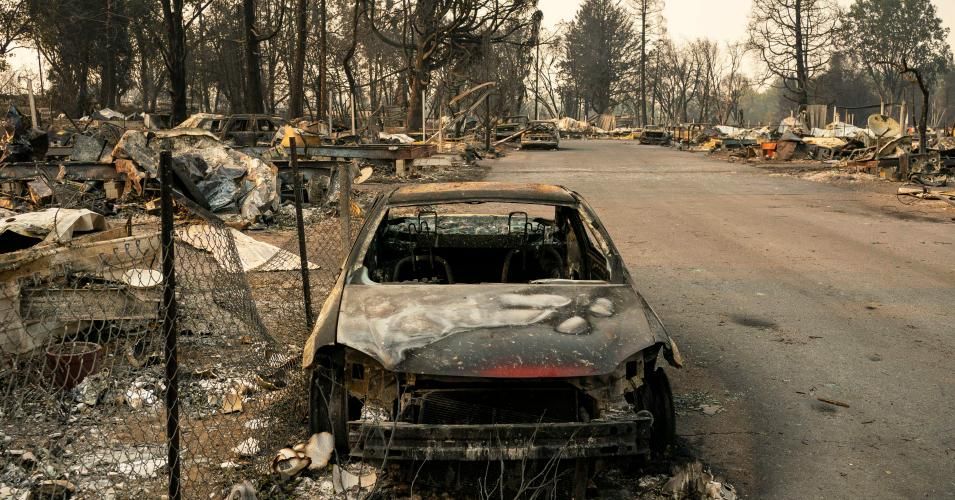 A damaged car sits in a mobile home park destroyed by fire on September 10, 2020 in Phoenix, Oregon. Hundreds of homes in the town have been lost due to wildfire. (Photo: David Ryder/Getty Images)