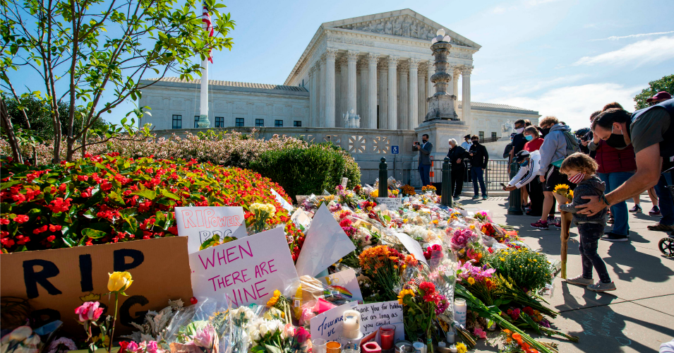 People place flowers outside of the U.S. Supreme Court in memory of Justice Ruth Bader Ginsburg, in Washington, D.C, on September 19, 2020. Ginsburg died September 18, opening a crucial vacancy on the high court, setting off a pitched political battle at the peak of the presidential campaign. (Photo: Jose Luis Magana/AFP via Getty Images)