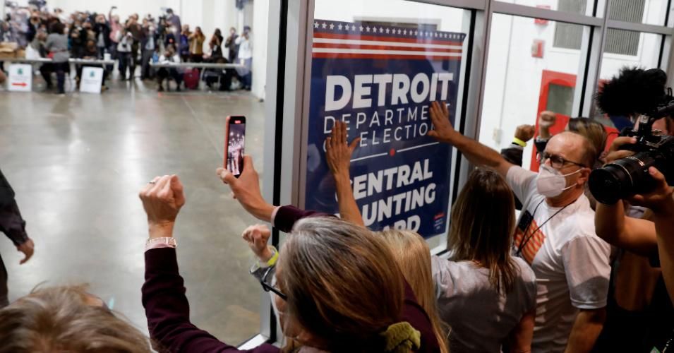 Supporters of U.S. President Donald Trump bang on the glass and chant slogans outside the room where absentee ballots for the 2020 general election are being counted at TCF Center on November 4, 2020 in Detroit, Michigan. (Photo: Jeff Kowalsky/AFP via Getty Images)