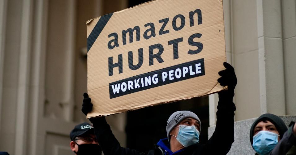 Amazon workers and community allies demonstrate during a protest organized by New York Communities for Change and Make the Road New York in front of the Jeff Bezos' Manhattan residence in New York on December 2, 2020. (Photo by Kena Betancur/AFP via Getty Images)