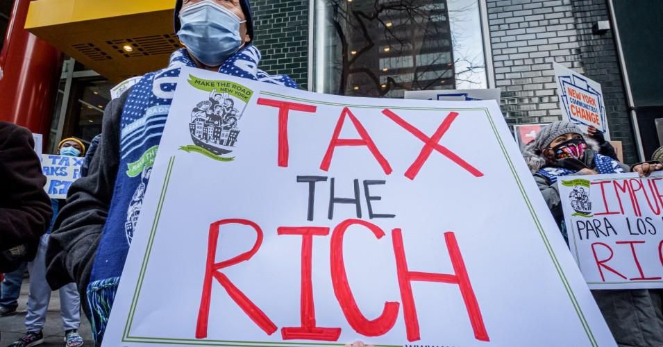 A demonstrator holding a sign during a protest on January 5, 2021 in Manhattan.