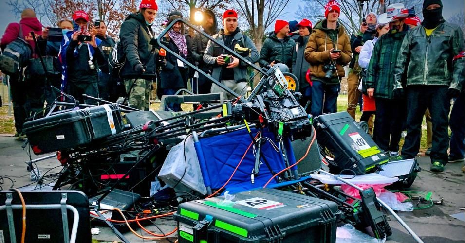 Supporters of U.S. President Donald Trump destroyed equipment of media crews outside the Capitol building in Washington, D.C. on January 06, 2021. (Photo: Agnes Bun/AFP via Getty Images)