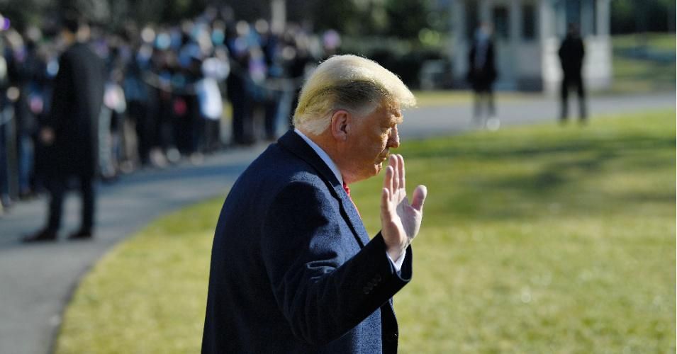 President Donald Trump waves to the media outside the White House on January 12, 2021 in Washington, D.C. before his departure to Alamo, Texas.