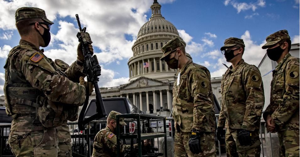 Virginia National Guard soldiers are issued their M4 rifles and live ammunition on the east front of the U.S. Capitol on January 17, 2021 in Washington, D.C.
