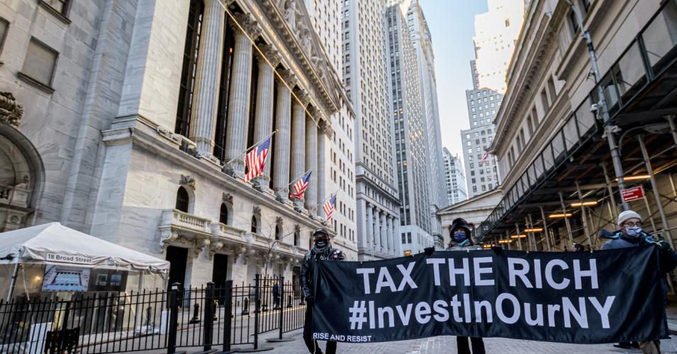 A coalition of activists gathered outside the New York Stock Exchange to call for higher taxes on the rich to fund Covid-19 recovery on January 28, 2021.