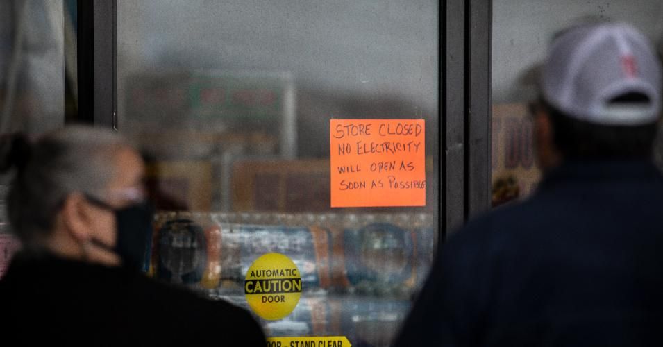 People wait in line for Fiesta Mart to open after the store lost electricity in Austin, Texas on February 17, 2021.