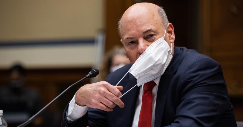 Postmaster General Louis DeJoy adjusts his mask as he testifies during a House Oversight and Reform Committee hearing February 24, 2021 on Capitol Hill in Washington, D.C.