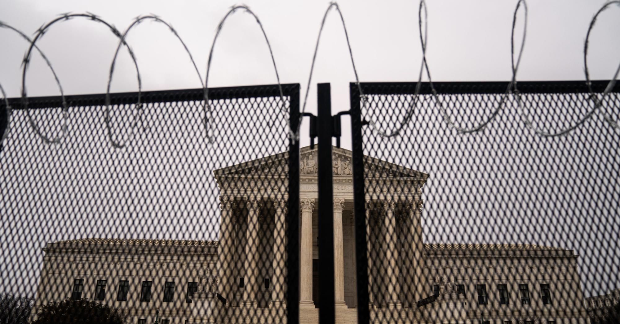 Razor wire-topped fencing is seen surrounding the Supreme Court of the United States on Monday, February 22, 2021 in Washington, D.C. (Photo: Kent Nishimura / Los Angeles Times via Getty Images)