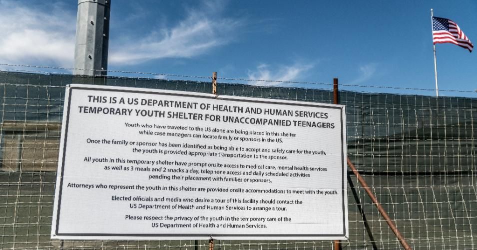 A sign outside of a Influx Care Facility (ICF) for unaccompanied children explains what the facility is on Sunday, February 21, 2021 in Carrizo Springs, Texas. (Photo: Sergio Flores/<em>The Washington Post</em> via Getty Images)