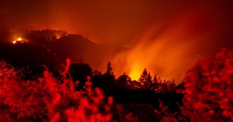 In this long exposure photo, the LNU Lightning Complex fire continues to burn in the ridges near Chemise Road in Healdsburg, California on August 21, 2020. (Photo: Ray Chavez/MediaNews Group/The Mercury News via Getty Images)