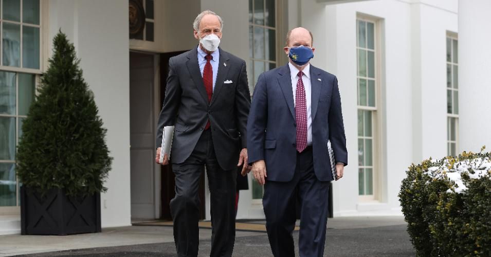 Sen. Tom Carper (D-Del.) and Sen. Chris Coons (D-Del) walk out of the West Wing after meeting with President Joe Biden at the White House February 3, 2021 in Washington, D.C.