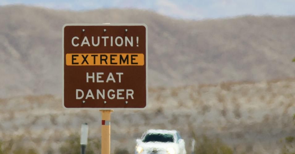 Heatwaves rise near a heat danger warning sign on the eve of the AdventurCORPS Badwater 135 ultra-marathon race on July 14, 2013 in Death Valley National Park, California. (Photo: David McNew/Getty Images)