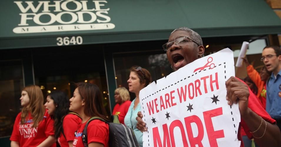 Betty Bailey of SEIU Local 1 protests with Whole Foods Market employees and other union activists outside a Whole Foods Market store on July 31, 2013 in Chicago.