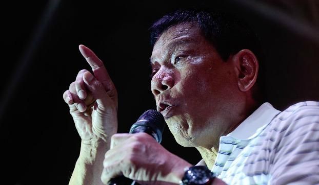 Philippine presidential candidate Rodrigo Duterte gestures during a campaign rally on April 23, 2016 in Manila, Philippines.