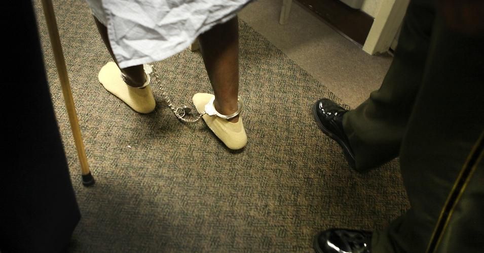 An inmate is escorted to a rehabilitation exercise at a Bay Area hospital Feb. 23, 2011. 