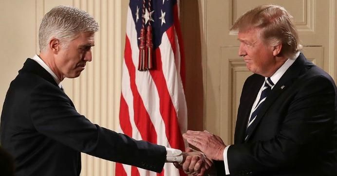 U.S. President Donald Trump (R) shakes hands with Judge Neil Gorsuch after nominating him to the Supreme Court during a ceremony in the East Room of the White House January 31, 2017 in Washington, D.C.